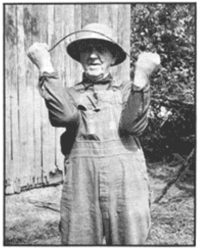 Old-timer dowsing with rods Old-timer dowsing with rods